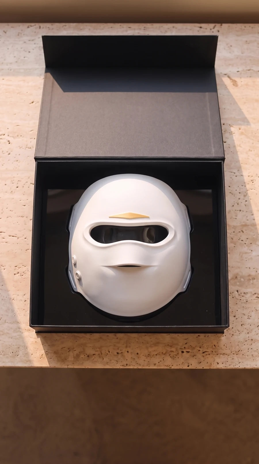 The mask in its gift box
